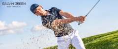 Galvin Green story case fashion boy wearing a white shirt and black trousers playing golf